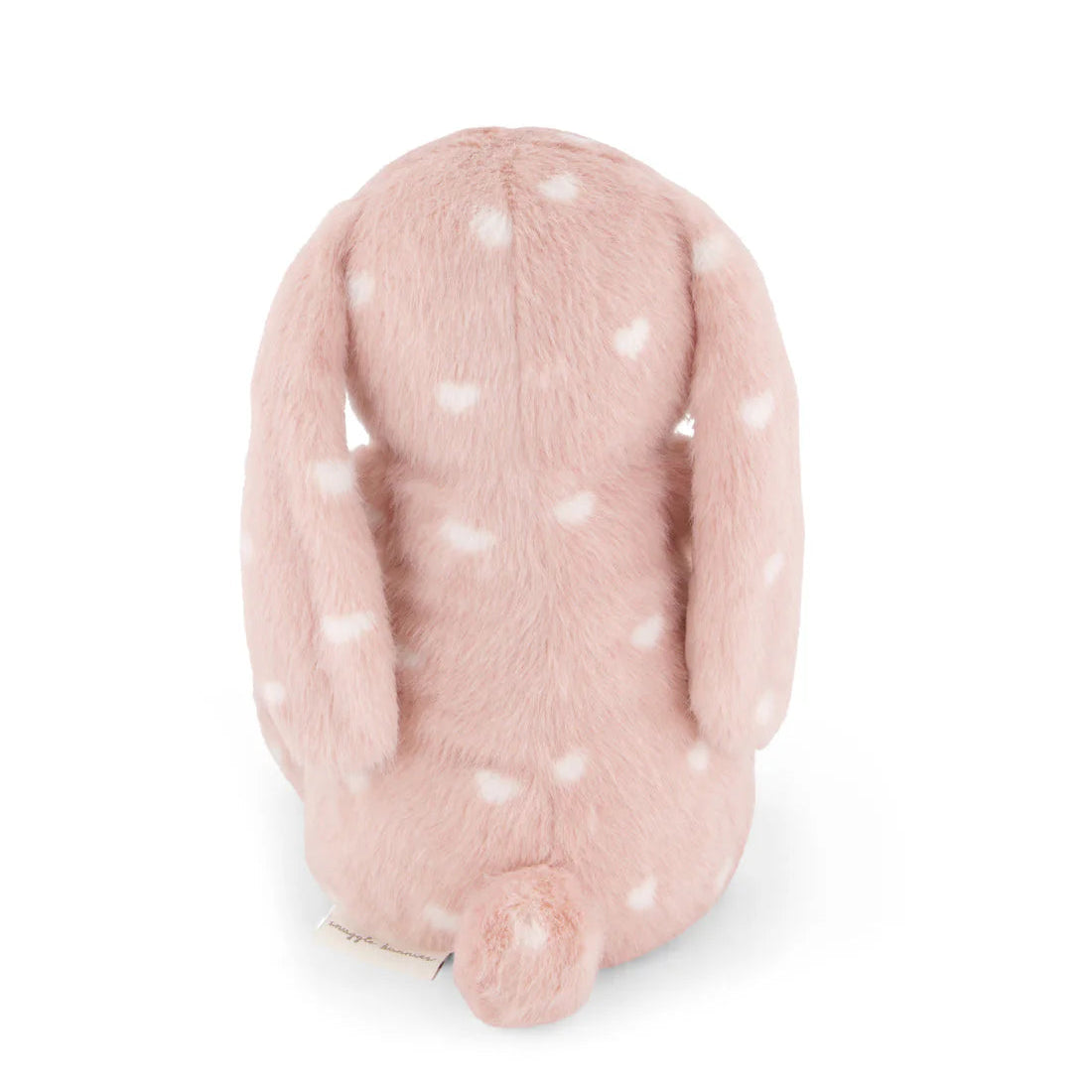 Pink plush bunny with white polka dots on a white background