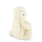 Small cream-colored plush toy on a white background