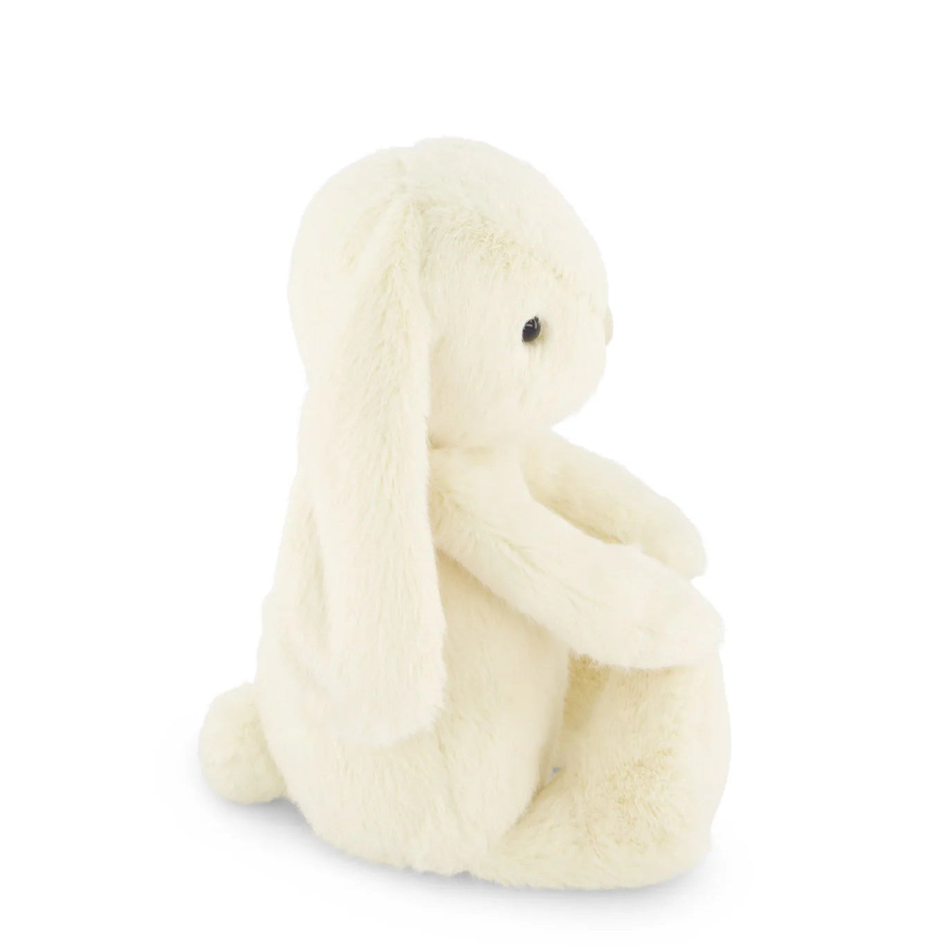 Small cream-colored plush toy on a white background