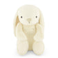 Cream-colored plush bunny toy on a white background