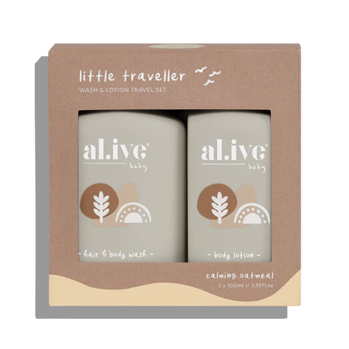 A boxed baby travel set from 'little traveller' containing two bottles of 'al ive' baby hair and body wash and body lotion in calming oatmeal scent, shown in a brown kraft paper box.
