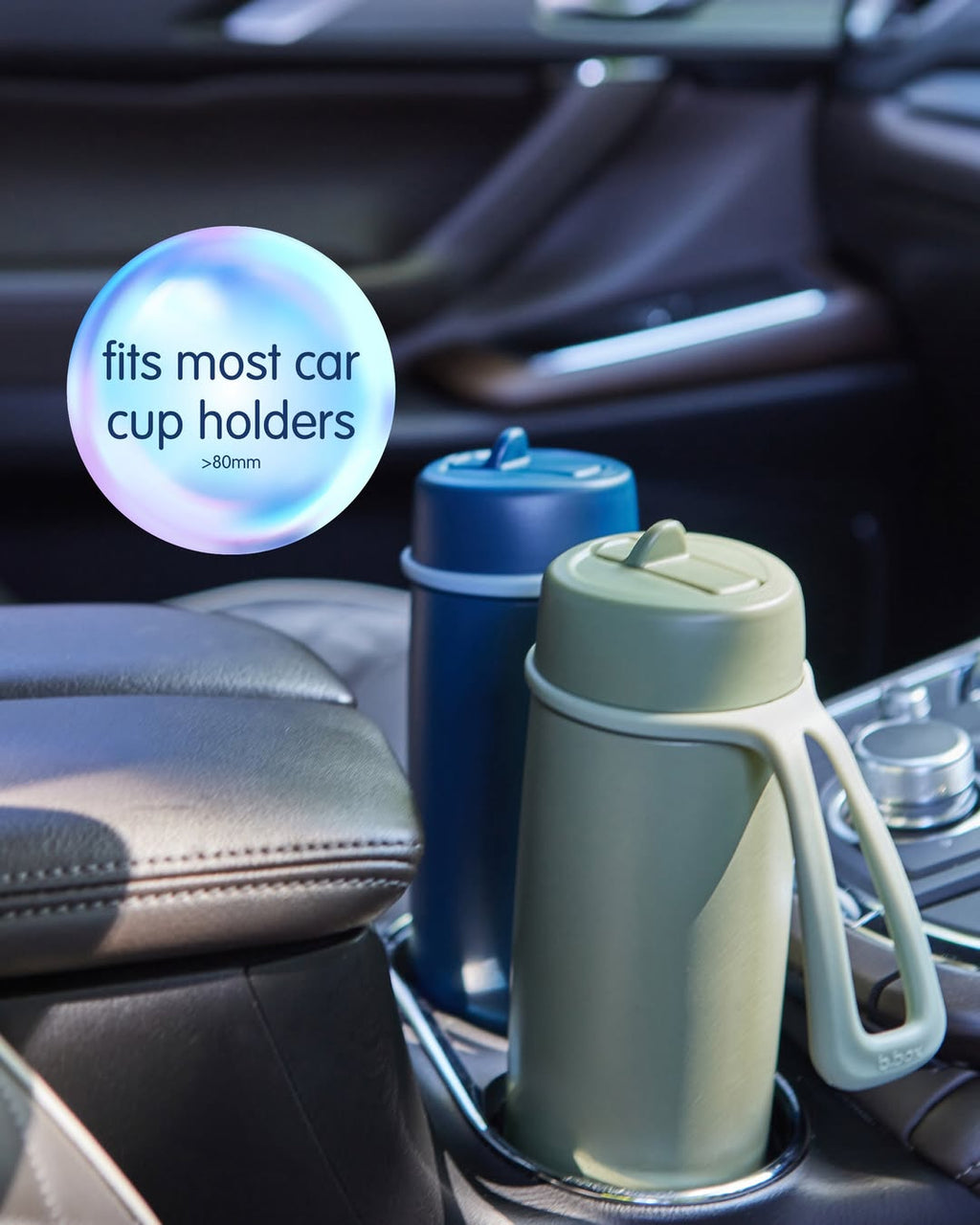 Two insulated travel mugs in a car cup holder with text indicating compatibility.