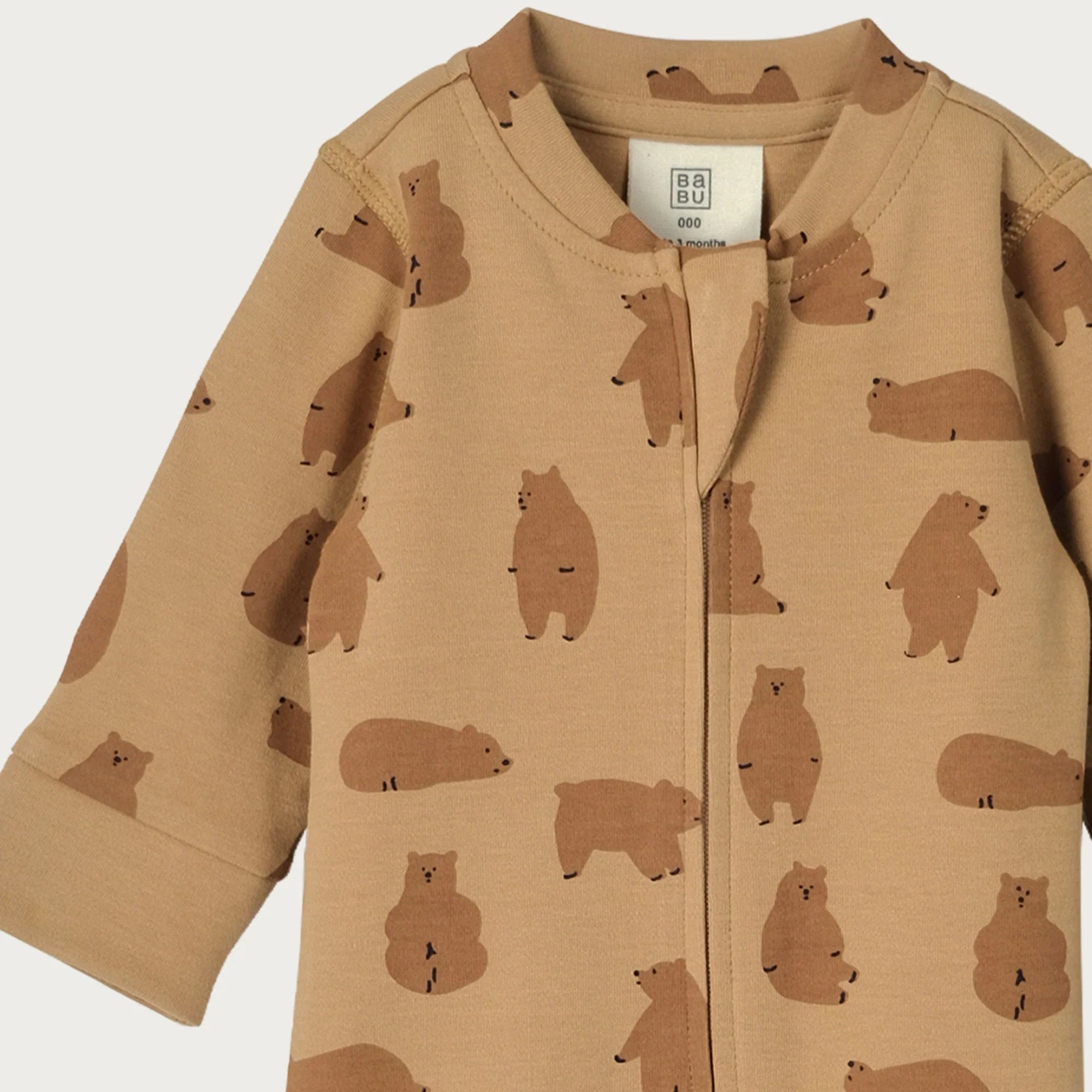 Brown baby onesie with bear pattern on a white background