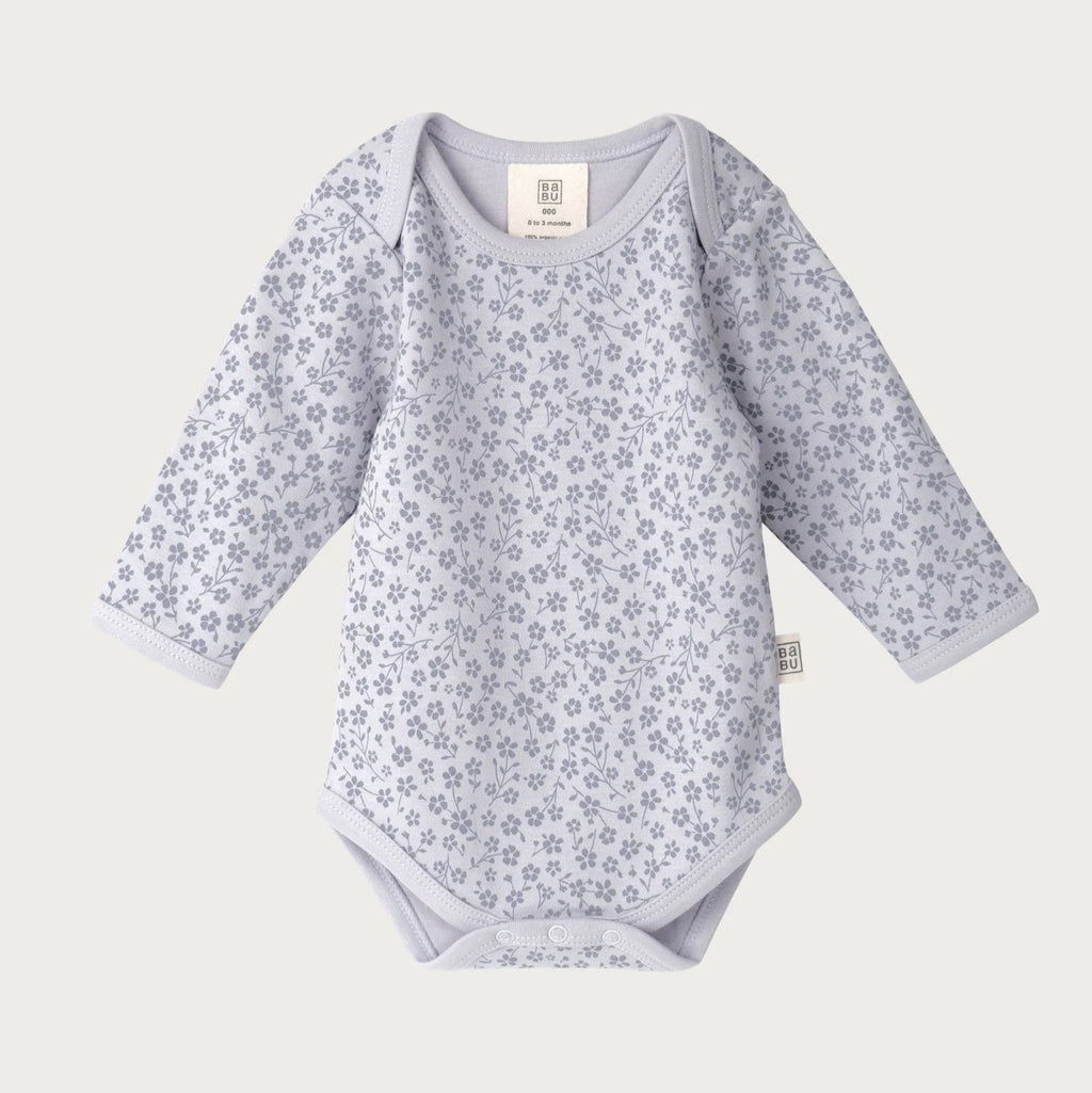 Baby bodysuit with floral pattern on a white background