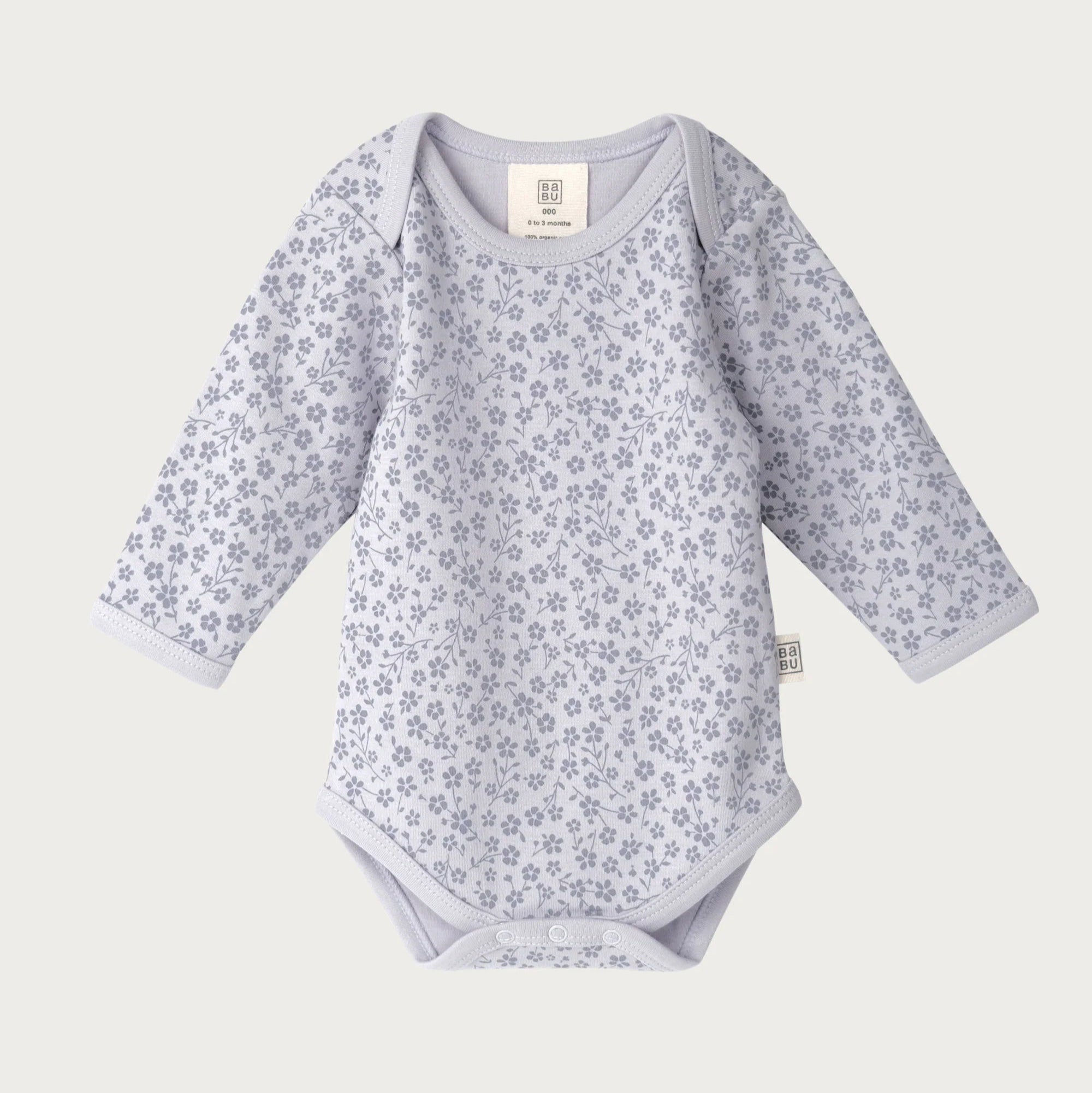 Baby bodysuit with floral pattern on a white background
