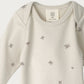 Baby onesie with star pattern on a white background