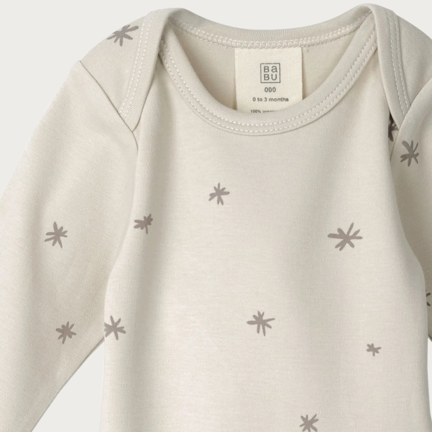 Baby onesie with star pattern on a white background