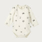 Baby onesie with animal prints on a white background