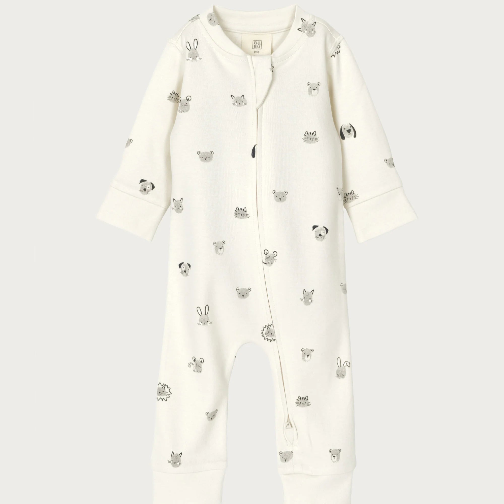 White baby onesie with animal prints on a white background