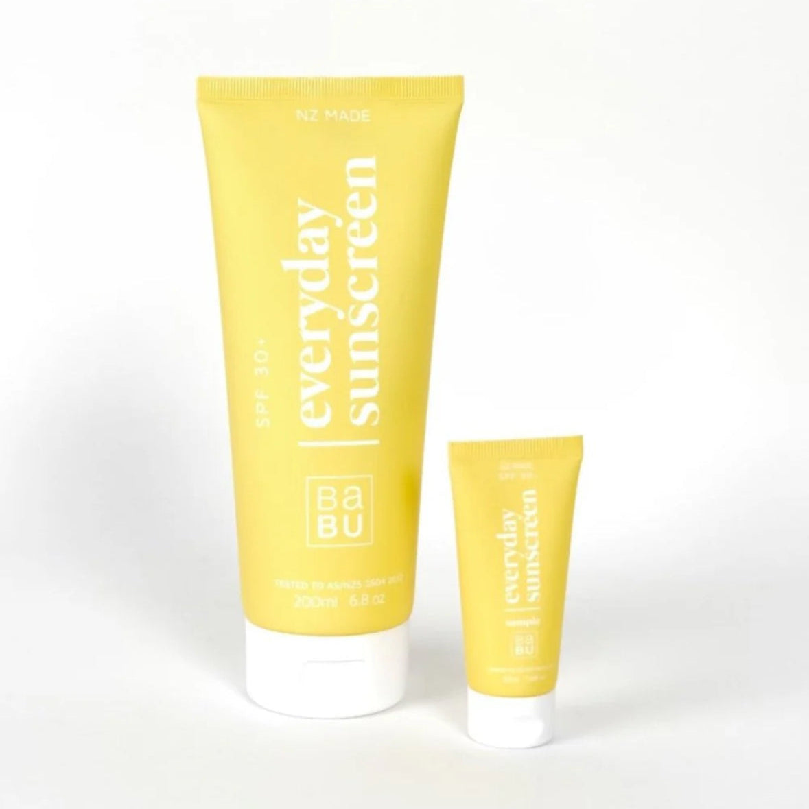 Two yellow tubes of 'everyday sunscreen' on a white background