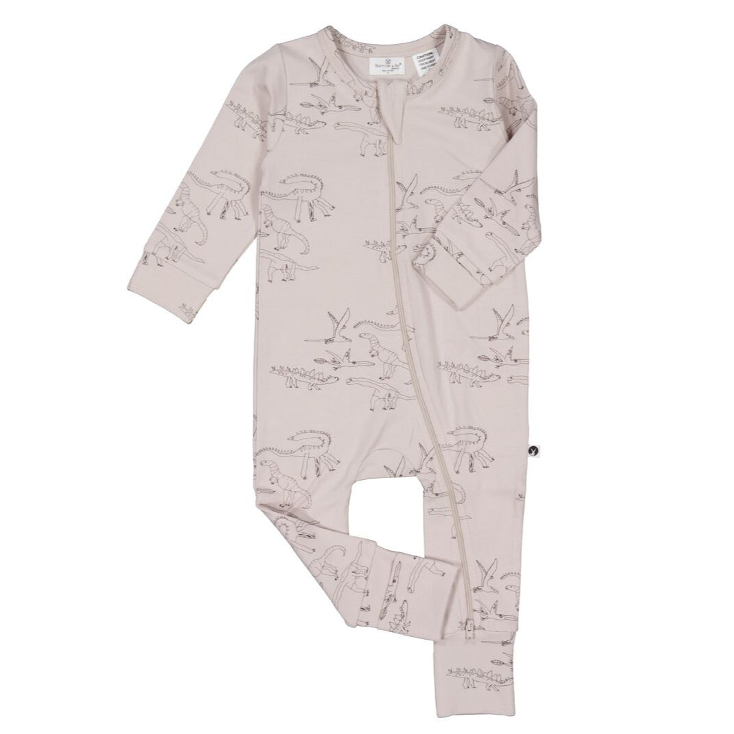 Light beige baby onesie with a dino pattern on a white background