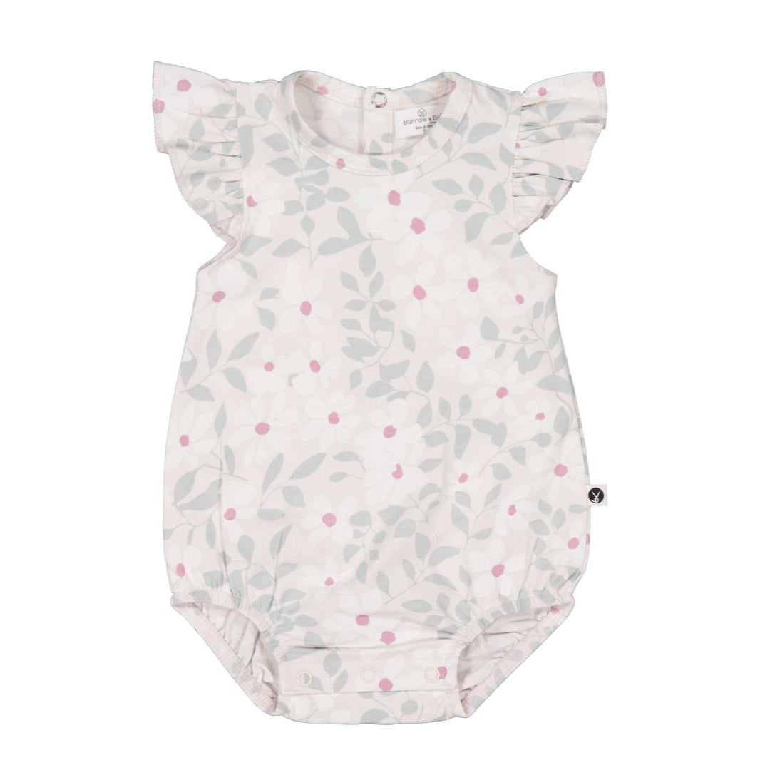 Baby romper with floral pattern on a white background