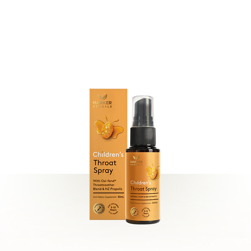 Children's throat spray bottle and packaging on a white background