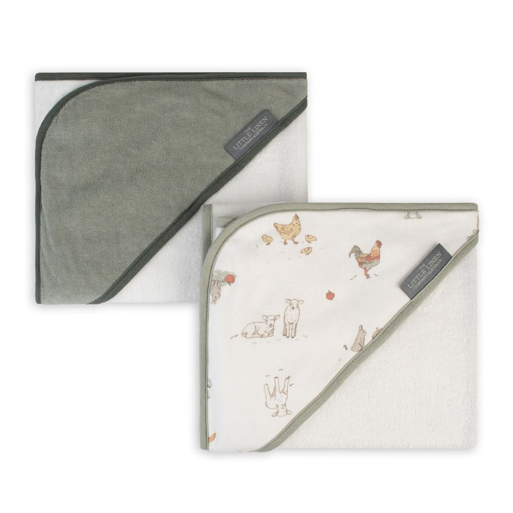 Two hooded towels, one green and one with farm animal pattern, on a white background.