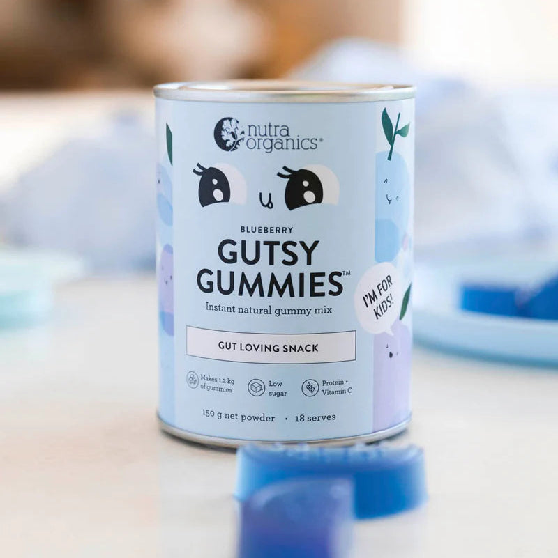 Can of Nutta Organics Blueberry Gutsy Gummies on a blurred background