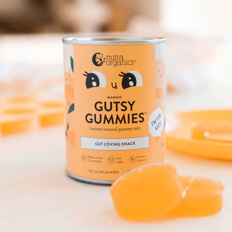 Can of Nutra Organics Gutsy Gummies with gummy bears on a blurred background