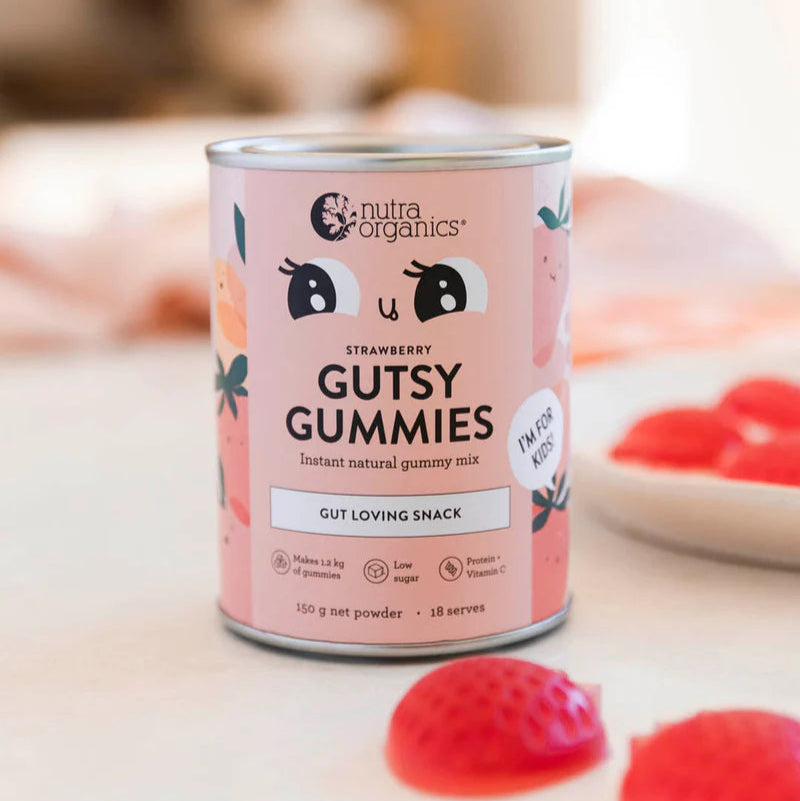 Can of Nutra Organics Gutsy Gummies with strawberries on a light background