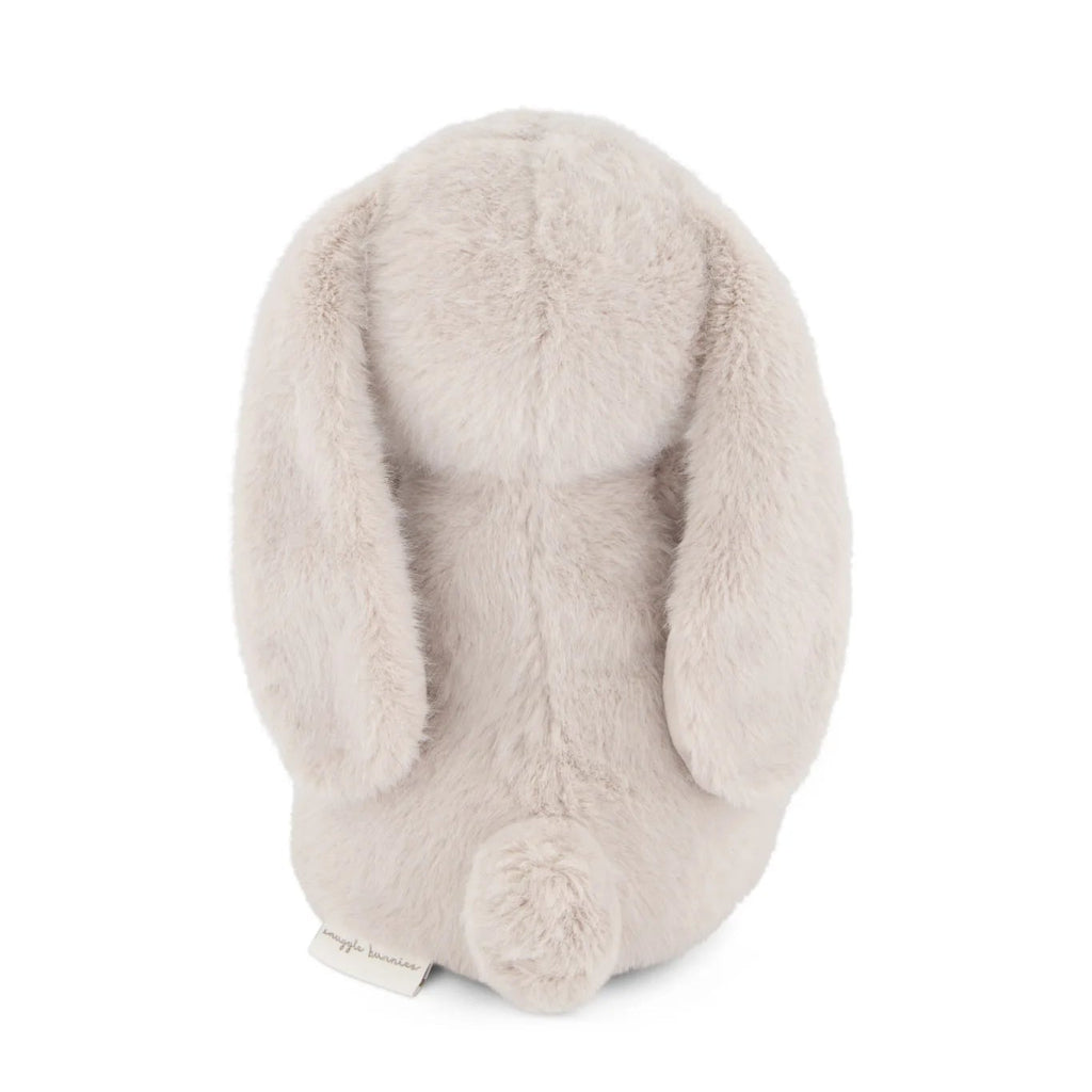 Beige bunny-shaped plush toy on a white background