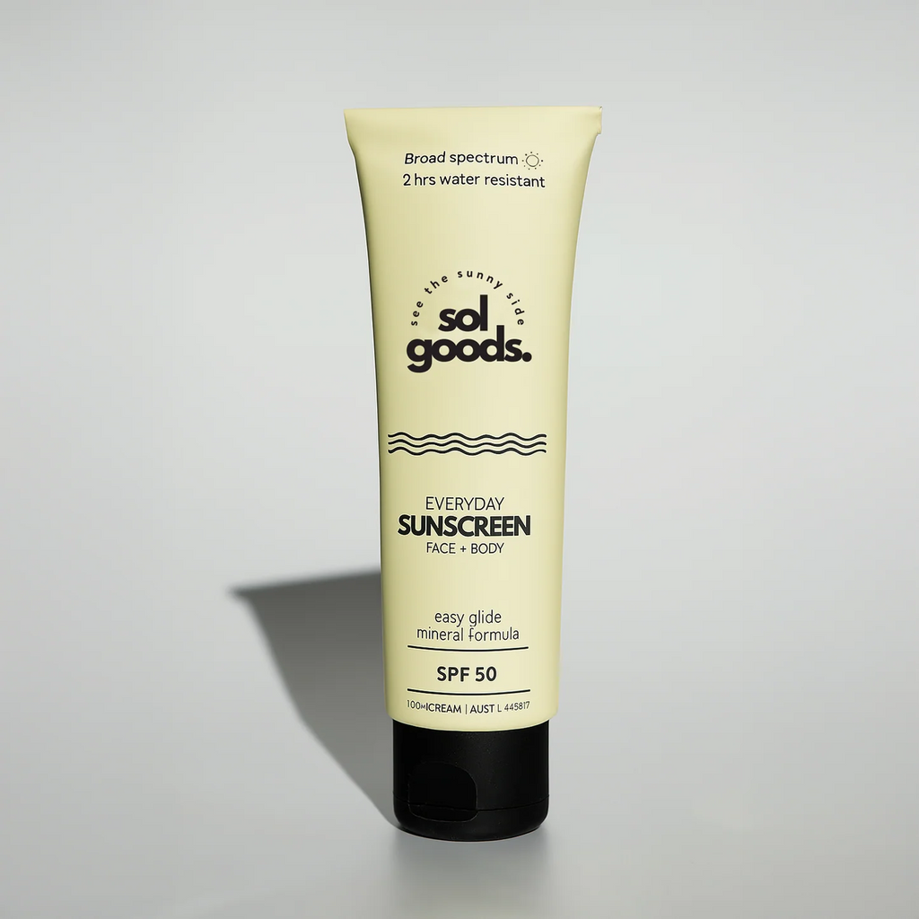 Sunscreen tube labeled 'sol goods' on a light gray background