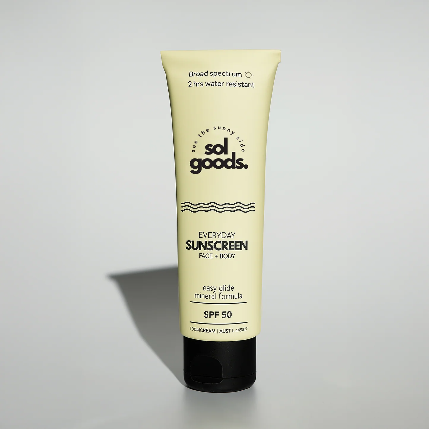 Sunscreen tube labeled 'sol goods' on a light gray background